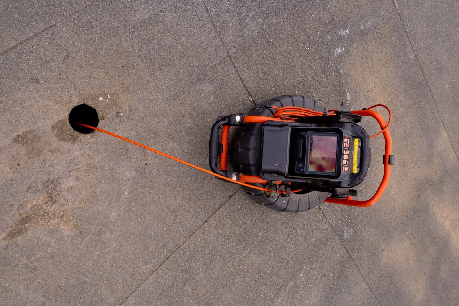 A CCTV drain inspection camera being fed into a drain access point during a routine maintenance survey in Yorkshire